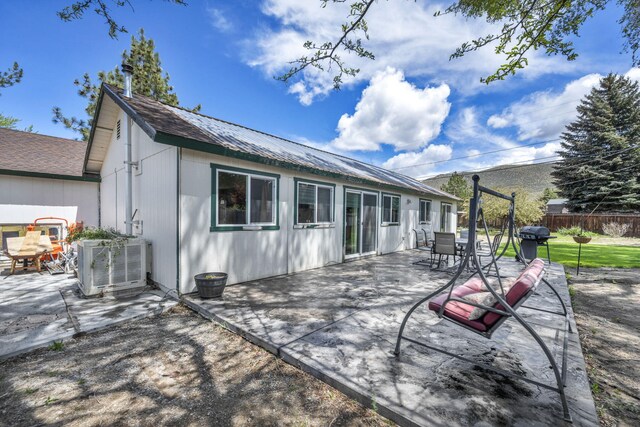 3760 Brant St, Reno, NV 89508 - rear view of property featuring central AC and a patio area