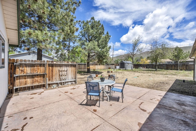 3760 Brant St, Reno, NV 89508 - fenced backyard featuring a patio, outdoor dining space, and a gate