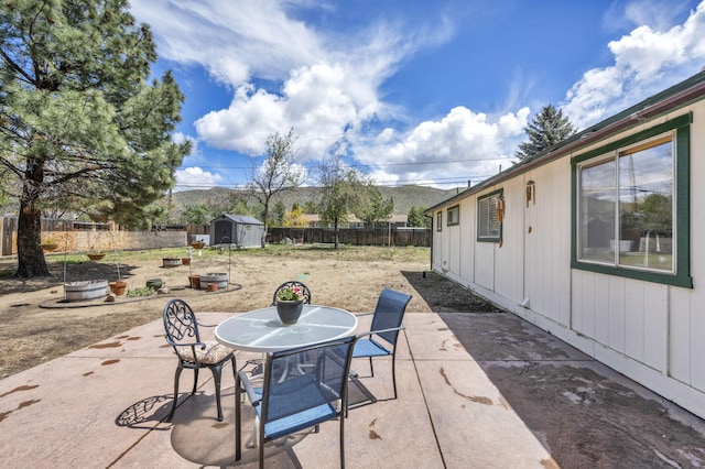 3760 Brant St, Reno, NV 89508 - fenced backyard featuring a patio and outdoor dining area