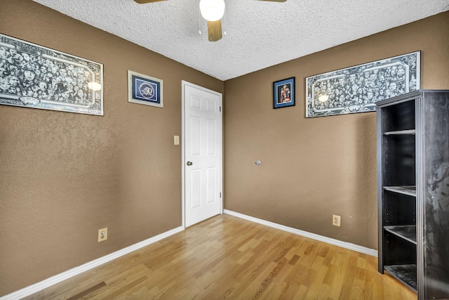 3760 Brant St, Reno, NV 89508 - unfurnished bedroom with light wood-style floors, baseboards, a textured ceiling, and ceiling fan