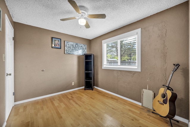 3760 Brant St, Reno, NV 89508 - unfurnished bedroom featuring light wood finished floors, a textured ceiling, a ceiling fan, and baseboards