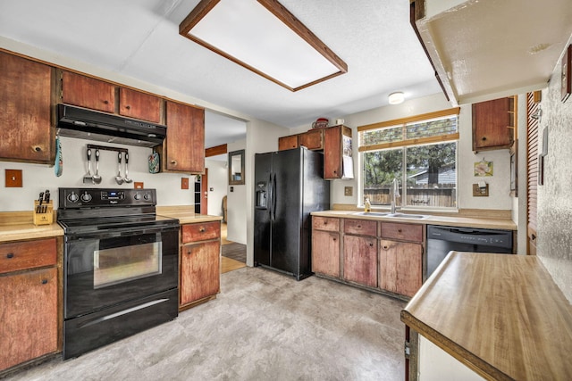 3760 Brant St, Reno, NV 89508 - kitchen featuring black appliances, under cabinet range hood, a sink, and light countertops