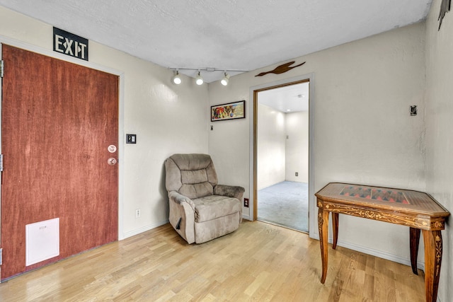 3760 Brant St, Reno, NV 89508 - living area featuring light wood-type flooring and rail lighting