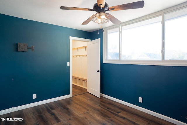 435 Ardmore Dr, Reno, NV 89509 - unfurnished bedroom with baseboards, wood finished floors, and ceiling fan