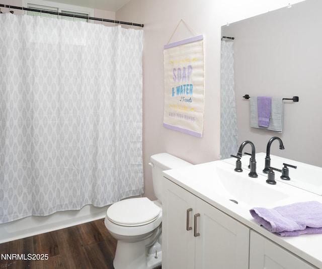 435 Ardmore Dr, Reno, NV 89509 - bathroom with vanity, toilet, wood finished floors, and shower / bath combo with shower curtain