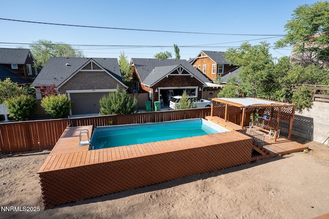 435 Ardmore Dr, Reno, NV 89509 - view of swimming pool featuring a wooden deck and a fenced backyard