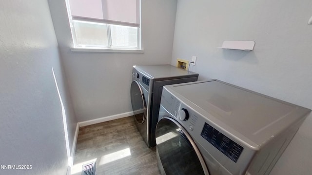 6042 Walnut Creek Rd, Reno, NV 89523 - laundry room with washing machine and clothes dryer and light wood-type flooring