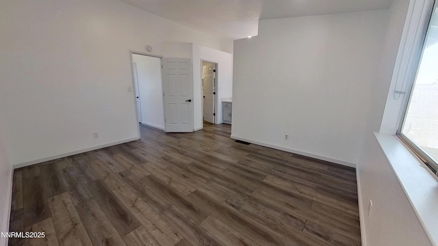 6042 Walnut Creek Rd, Reno, NV 89523 - unfurnished room with dark wood-type flooring and baseboards