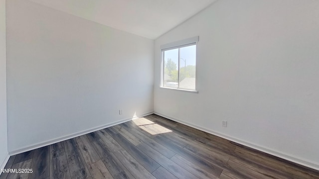 6042 Walnut Creek Rd, Reno, NV 89523 - unfurnished room featuring vaulted ceiling and dark wood-style flooring