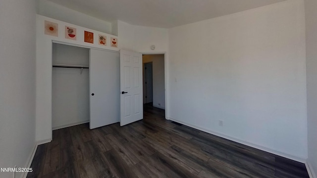 6042 Walnut Creek Rd, Reno, NV 89523 - unfurnished bedroom featuring dark wood-style floors and a closet
