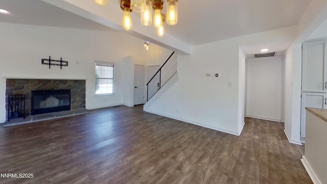 6042 Walnut Creek Rd, Reno, NV 89523 - unfurnished living room with dark wood-style floors, a chandelier, stairway, and a fireplace