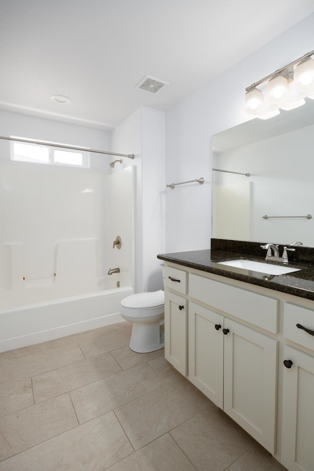 772 Megan Way, Fallon, NV 89406 - bathroom featuring toilet, vanity,  shower combination, and tile patterned flooring