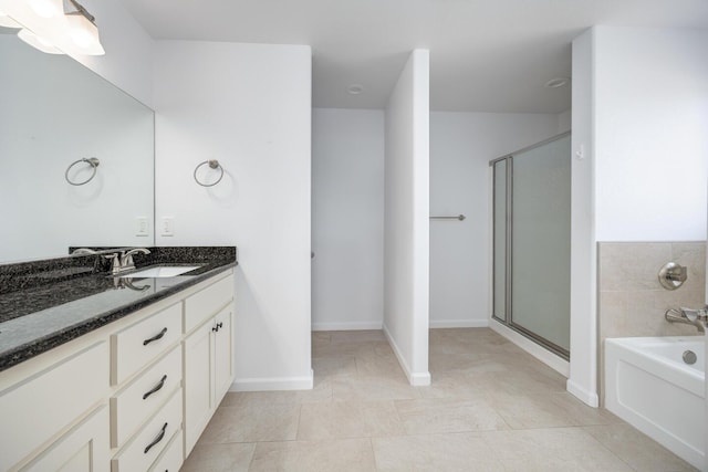 772 Megan Way, Fallon, NV 89406 - bathroom featuring vanity, a stall shower, a garden tub, and tile patterned flooring