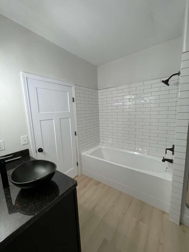1673 Midas Dr, Winnemucca, NV 89445 - full bathroom featuring wood finished floors, bathtub / shower combination, and vanity