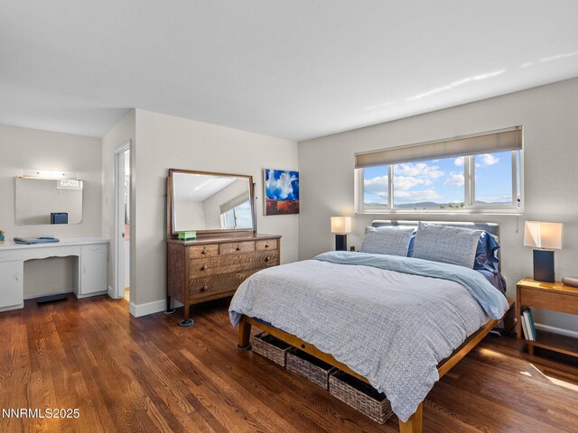 60 Redstone Dr, Reno, NV 89512 - bedroom with wood finished floors, baseboards, and a desk