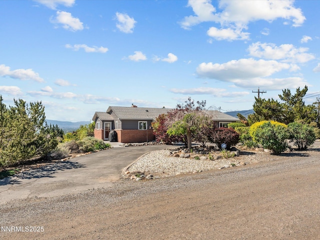 60 Redstone Dr, Reno, NV 89512 - view of front of home with concrete driveway and brick siding