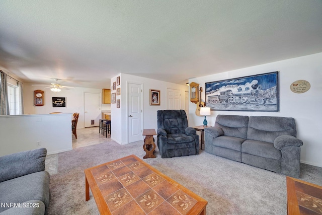 636 Aja Pl, Dayton, NV 89403 - living room with carpet floors, ceiling fan, baseboards, and a textured ceiling