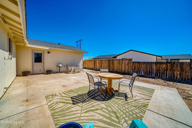 636 Aja Pl, Dayton, NV 89403 - fenced backyard with outdoor dining space and a patio area