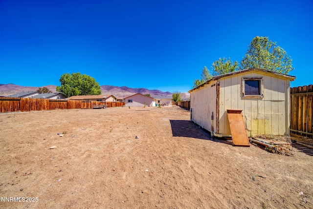 636 Aja Pl, Dayton, NV 89403 - fenced backyard featuring a mountain view and an outdoor structure