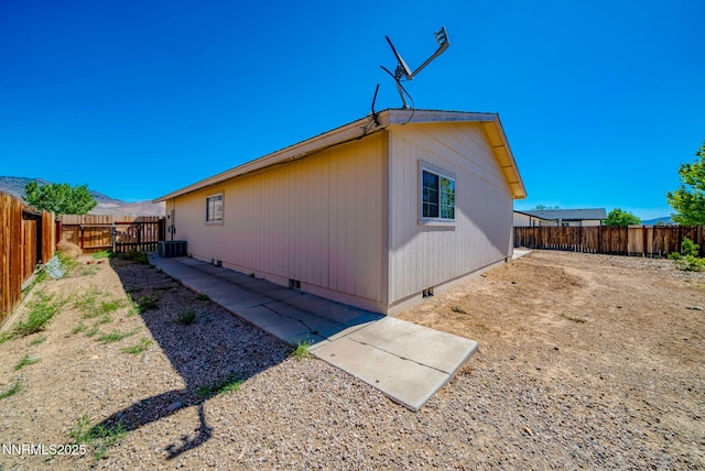 636 Aja Pl, Dayton, NV 89403 - view of home's exterior featuring crawl space, a fenced backyard, and central air condition unit