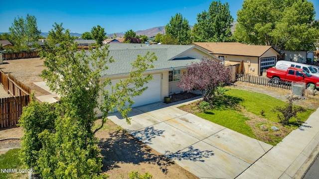 636 Aja Pl, Dayton, NV 89403 - view of front of home with driveway, an attached garage, roof with shingles, a mountain view, and a residential view