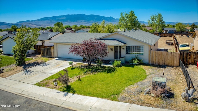 636 Aja Pl, Dayton, NV 89403 - single story home with a garage, a mountain view, driveway, and a residential view