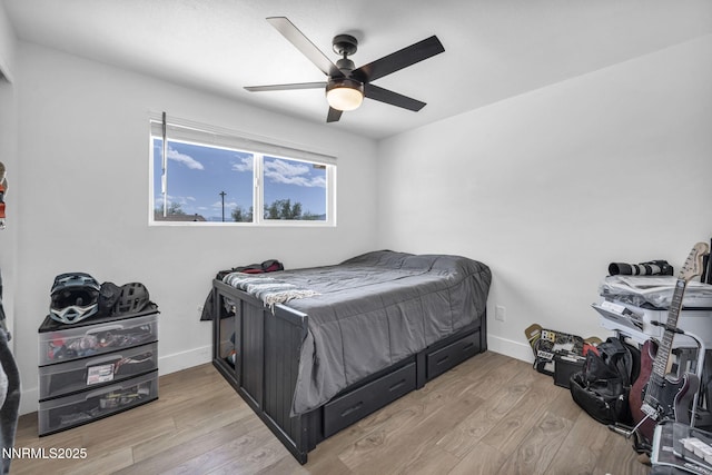 11471 Sitka St, Reno, NV 89506 - bedroom featuring light wood-style floors, baseboards, and a ceiling fan