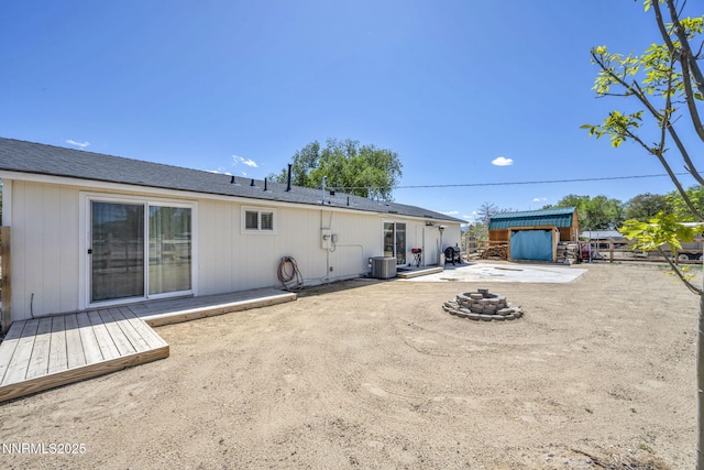 11471 Sitka St, Reno, NV 89506 - rear view of property with cooling unit, a patio area, and a fire pit