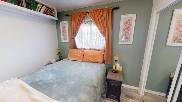 1615 Ballard Ln, Winnemucca, NV 89445 - bedroom featuring wood finished floors and baseboards
