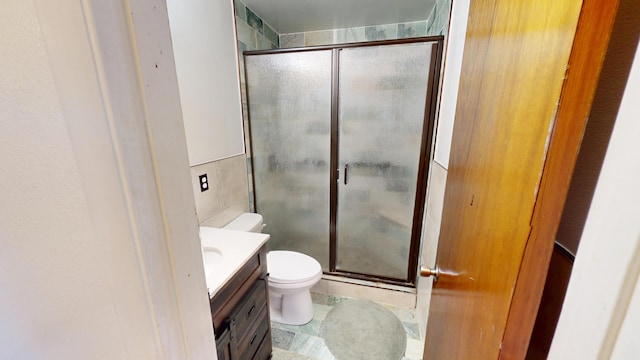 1615 Ballard Ln, Winnemucca, NV 89445 - full bath featuring tile walls, vanity, a stall shower, and toilet