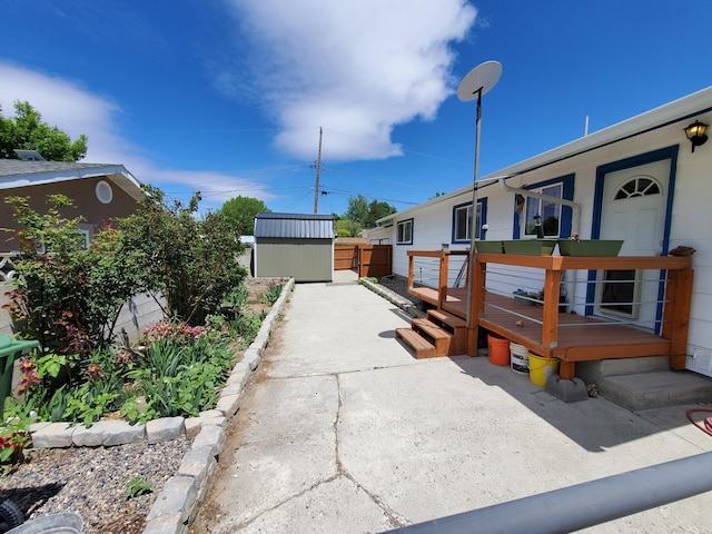 1615 Ballard Ln, Winnemucca, NV 89445 - view of home's exterior with a storage shed, an outbuilding, a deck, a patio area, and fence