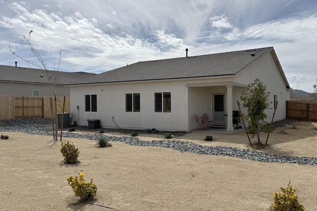 1733 Treeline Dr, Fernley, NV 89408 - rear view of property featuring roof with shingles, central air condition unit, and stucco siding