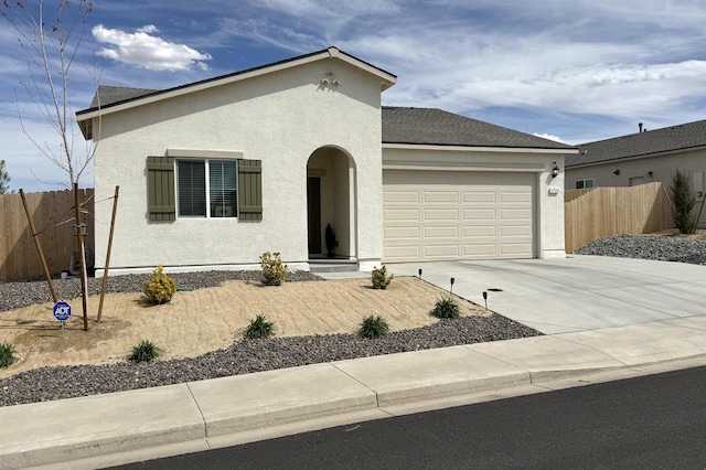1733 Treeline Dr, Fernley, NV 89408 - view of front facade with stucco siding, an attached garage, concrete driveway, and roof with shingles