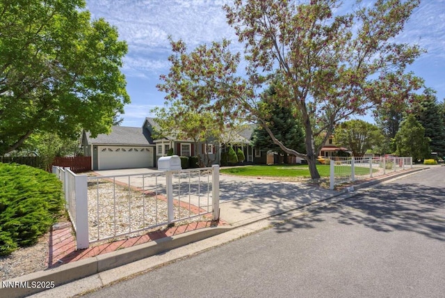3277 Dartmouth Ct, Carson City, NV 89703 - view of property hidden behind natural elements featuring concrete driveway, an attached garage, and a gate