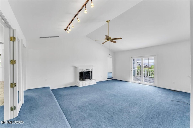 3277 Dartmouth Ct, Carson City, NV 89703 - unfurnished living room featuring a ceiling fan, rail lighting, carpet floors, a fireplace, and lofted ceiling