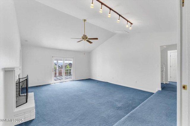 3277 Dartmouth Ct, Carson City, NV 89703 - unfurnished living room with rail lighting, carpet, a ceiling fan, vaulted ceiling, and baseboards