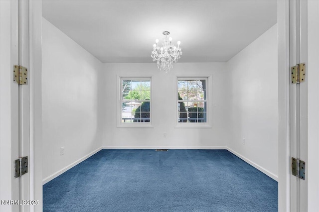3277 Dartmouth Ct, Carson City, NV 89703 - empty room with dark carpet, a chandelier, and baseboards