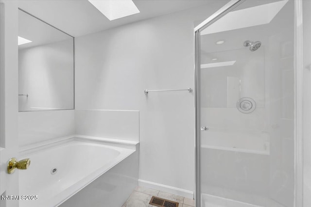 3277 Dartmouth Ct, Carson City, NV 89703 - full bathroom with a shower stall, a skylight, a whirlpool tub, and tile patterned flooring