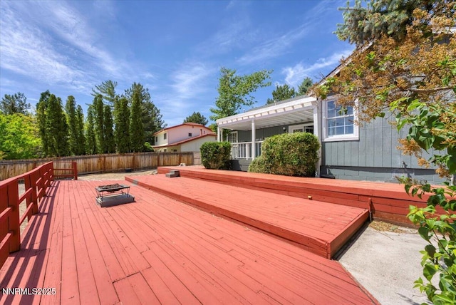3277 Dartmouth Ct, Carson City, NV 89703 - wooden terrace featuring a fenced backyard and an outdoor fire pit