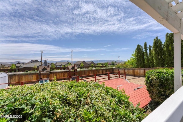 3277 Dartmouth Ct, Carson City, NV 89703 - wooden terrace with a fenced backyard and a residential view