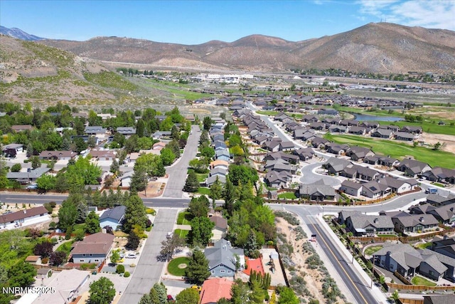 3277 Dartmouth Ct, Carson City, NV 89703 - aerial overview of property's location featuring nearby suburban area and a water and mountain view