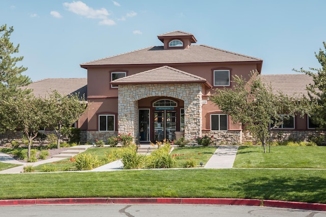 6850 Sharlands Ave Unit H2044, Reno, NV 89523 - view of front of property featuring stone siding, stucco siding, a front yard, and a tiled roof