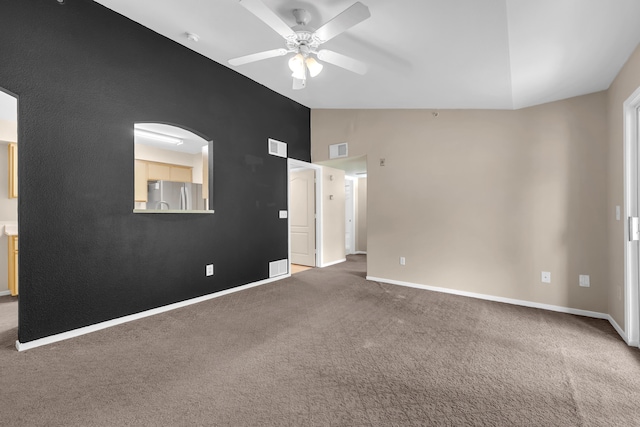 6850 Sharlands Ave Unit H2044, Reno, NV 89523 - carpeted spare room featuring ceiling fan, vaulted ceiling, and baseboards