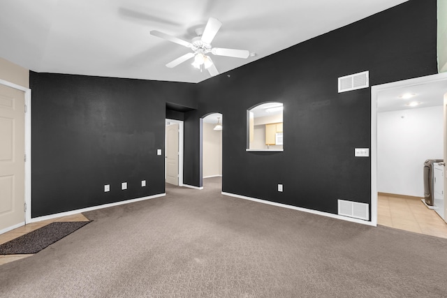 6850 Sharlands Ave Unit H2044, Reno, NV 89523 - empty room with light colored carpet, ceiling fan, arched walkways, and baseboards