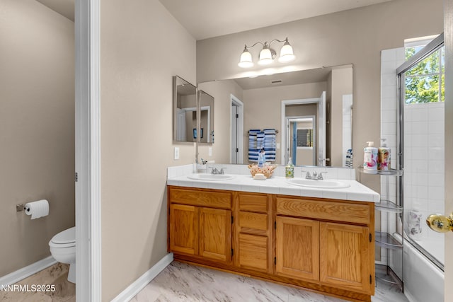 1635 Black Oak Rd, Sparks, NV 89436 - full bath with double vanity, toilet, tub / shower combination, marble look tiles, and baseboards