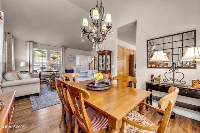 1635 Black Oak Rd, Sparks, NV 89436 - dining room featuring wood finished floors, a chandelier, and high vaulted ceiling