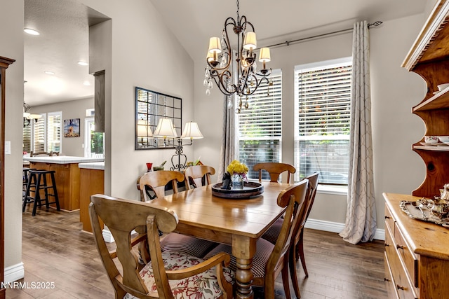 1635 Black Oak Rd, Sparks, NV 89436 - dining room featuring a chandelier, dark wood-style flooring, plenty of natural light, baseboards, and lofted ceiling