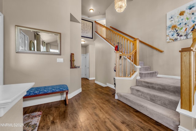 1635 Black Oak Rd, Sparks, NV 89436 - stairway with baseboards, wood finished floors, and a chandelier
