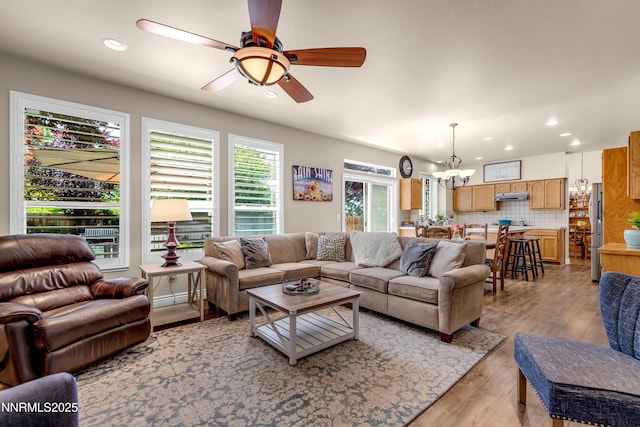 1635 Black Oak Rd, Sparks, NV 89436 - living area featuring a chandelier, ceiling fan, light wood-style flooring, and recessed lighting