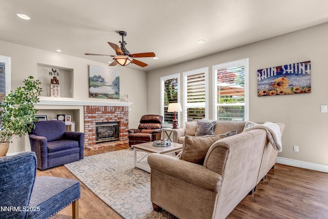 1635 Black Oak Rd, Sparks, NV 89436 - living room featuring wood finished floors, ceiling fan, a fireplace, recessed lighting, and baseboards